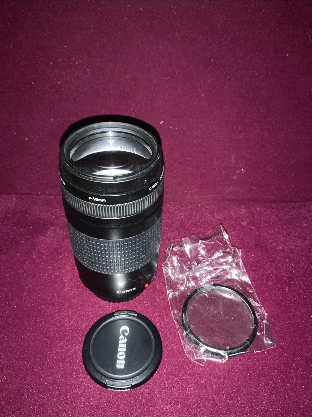 Canon Black 75-300mm f/1.4-5.6 ll Telephoto Zoom Lens with covers. Good cond.